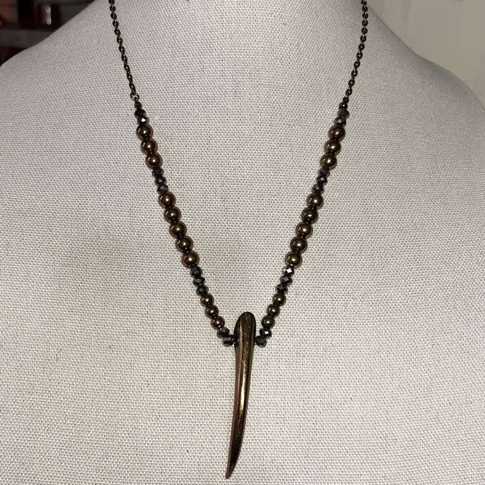 Gold and Black Tribal-Inspired Necklace with Tusk Pendant